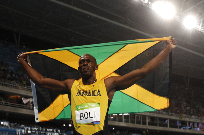 Jamaica's Usain Bolt celebrates after he won the Men's 200m Final during the athletics event at the Rio 2016 Olympic Games at the Olympic Stadium in Rio de Janeiro on August 18, 2016.   / AFP / Adrian DENNIS        (Photo credit should read ADRIAN DENNIS/AFP/Getty Images)