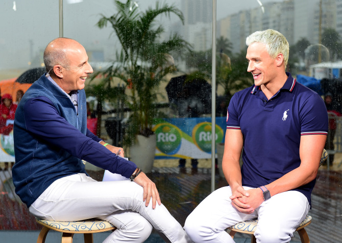 RIO DE JANEIRO, BRAZIL - AUGUST 12:  (BROADCAST - OUT) Host, Matt Lauer speaks with swimmer, Ryan Lochte of the United States on the Today show set on Copacabana Beach on August 12, 2016 in Rio de Janeiro, Brazil.  (Photo by Harry How/Getty Images)