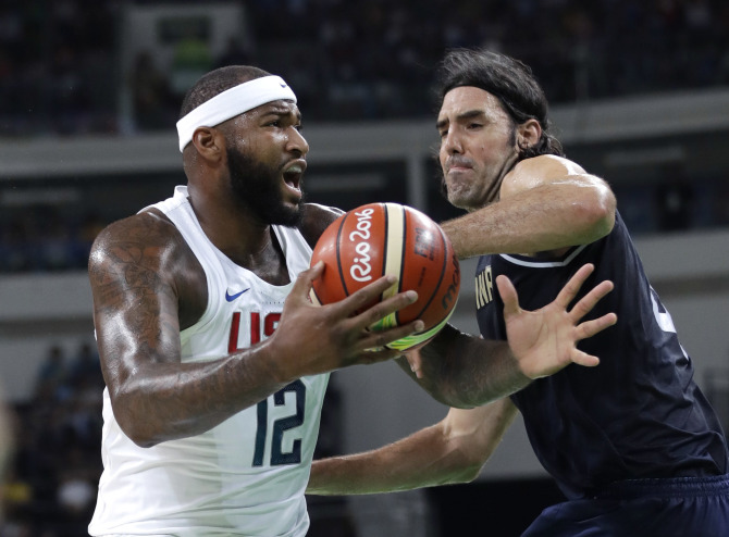 United States' DeMarcus Cousins (12) is pressured by Argentina's Luis Scola (4) during a men's quarterfinal round basketball game at the 2016 Summer Olympics in Rio de Janeiro, Brazil, Wednesday, Aug. 17, 2016. (AP Photo/Eric Gay)