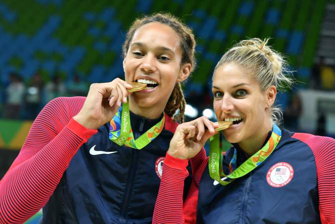 Gold medallists  USA's centre Brittney Griner (L) and USA's small forward Elena Delle Donne pose with their medal after the final of the Women's basketball competition at the Carioca Arena 1 in Rio de Janeiro on August 20, 2016 during the Rio 2016 Olympic Games. / AFP PHOTO / Andrej ISAKOVICANDREJ ISAKOVIC/AFP/Getty Images