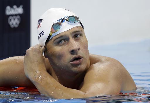 FILE - In this Tuesday, Aug. 9, 2016, file photo, United States' Ryan Lochte checks his time in a men's 4x200-meter freestyle heat at the 2016 Summer Olympics, in Rio de Janeiro, Brazil. Lochte is banned from swimming through next June and will forfeit $100,000 in bonus money that went with his gold medal at the Olympics, part of the penalty for his drunken encounter at a gas station in Brazil during last month's games. The U.S. Olympic Committee and USA Swimming announced the penalties Thursday.  (AP Photo/Michael Sohn, File)