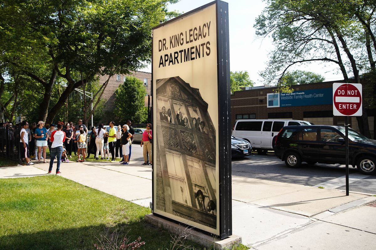 My Block My Hood My City youth tour guides making a stop outside the King Legacy Apartments in North Lawndale. | Annie Costabile/Sun-Times