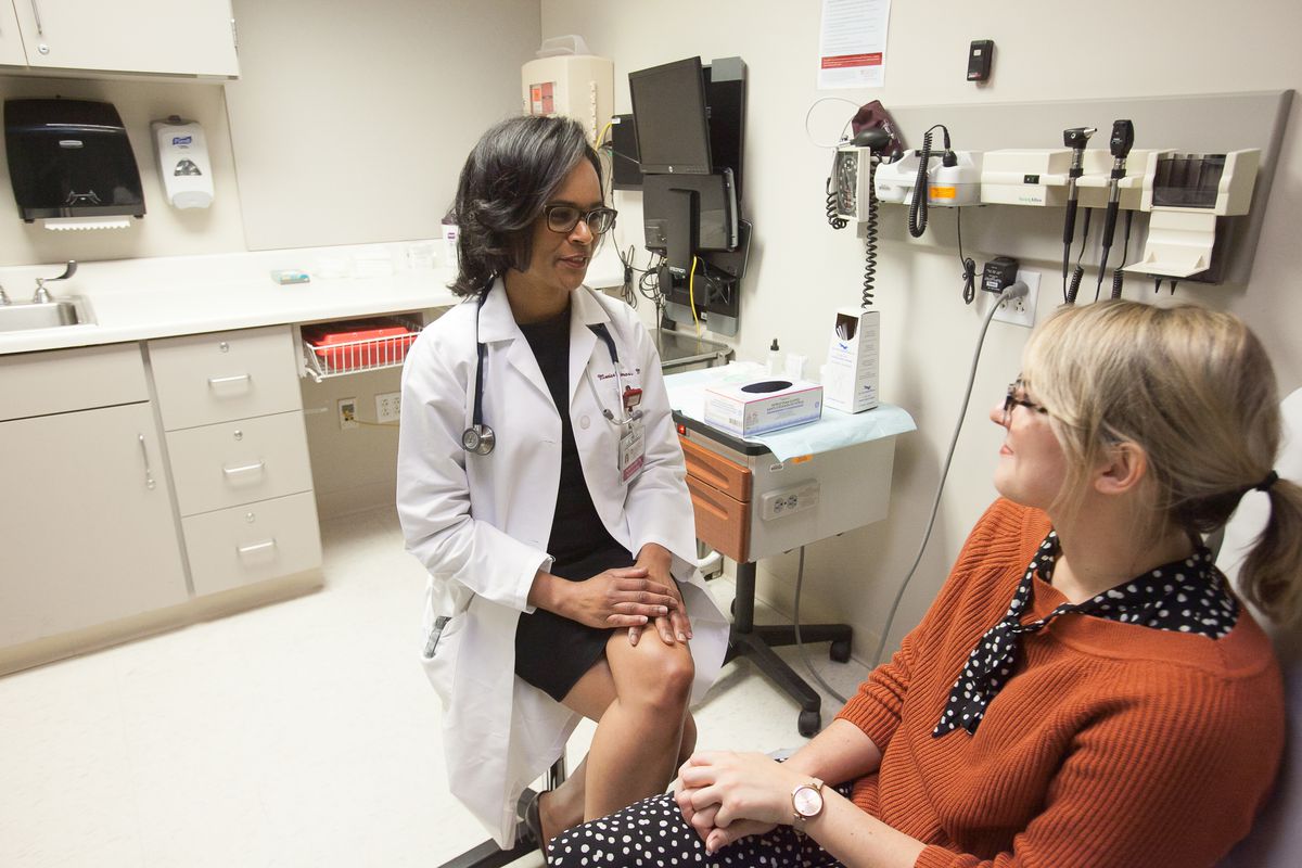 Monica Christmas, M.D., meets with a patient at the Duchossois Center for Advanced Medicine at the University of Chicago.