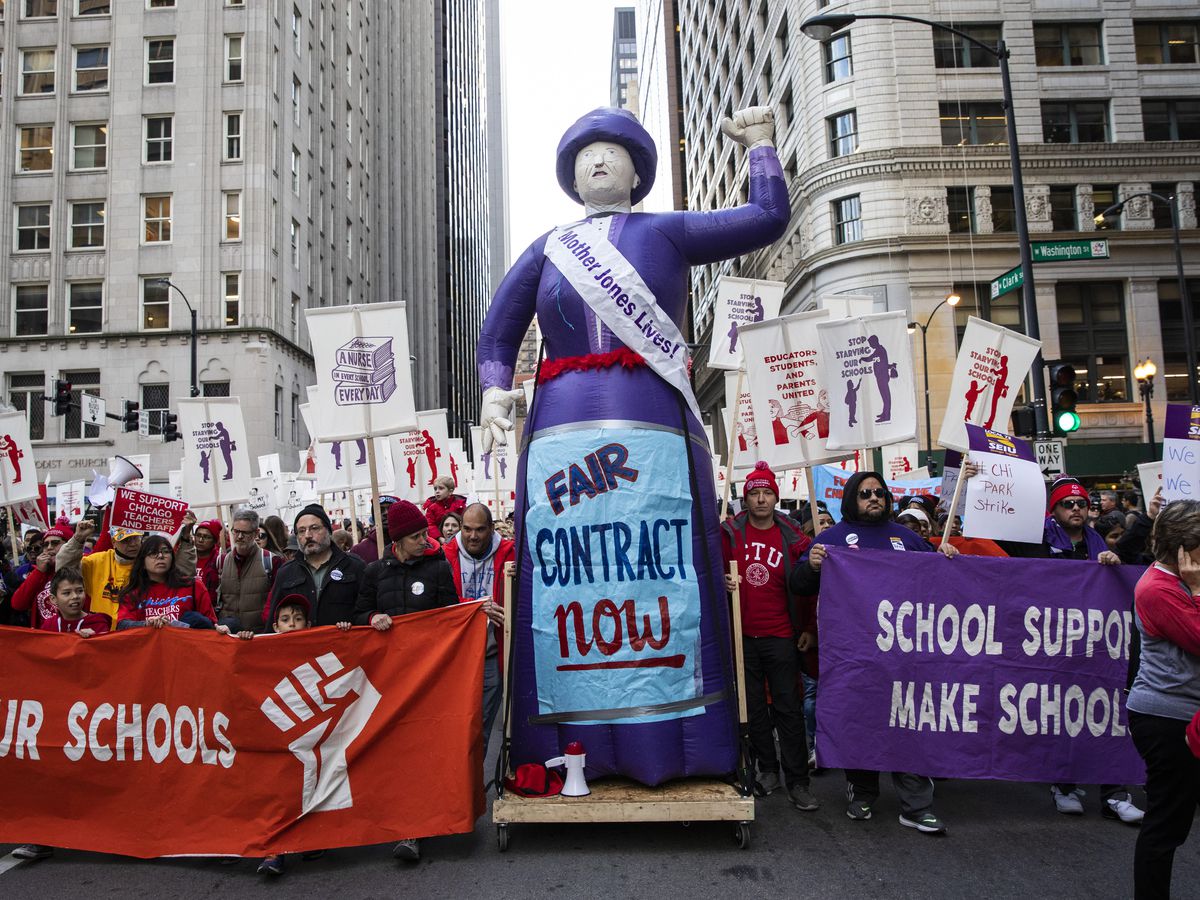 Members of the Chicago Teachers Union and SEIU Local 73 march through the Loop after a rally, three days before the unions could walk off the job on strike, Monday afternoon, Oct. 14, 2019.| Ashlee Rezin Garcia/Sun-Times