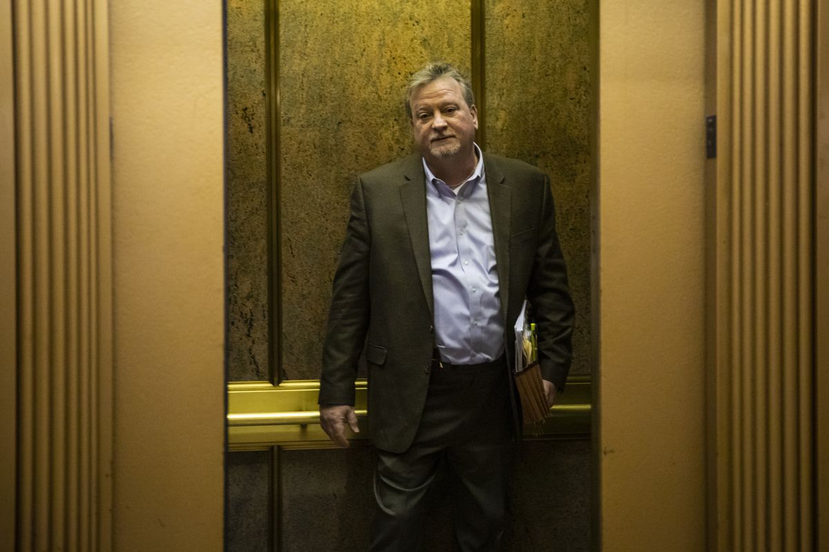 Cook County Commissioner Jeff Tobolski gets on an elevator to leave the County Building Tuesday after a board meeting of the Cook County Forest Preserve District.
