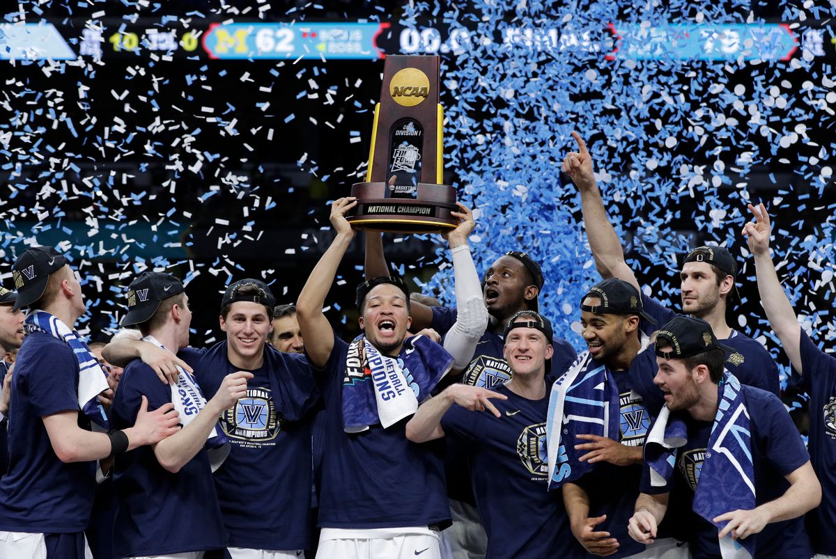 Villanova players celebrate with the trophy after winning the championship game of the Final Four NCAA college basketball tournament in 2018. 