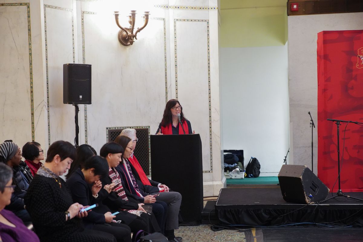 Julie Tiao Ma, president of the Chinese Fine Arts Society, speaks at the Lunar New Year celebration at the Chicago Cultural Center.