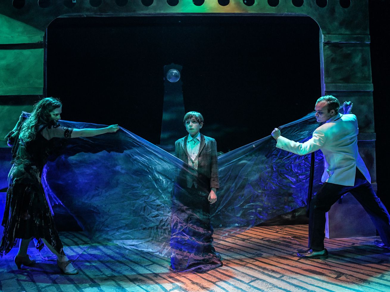 Mikaela Sullivan, Leo Spiegel and Kevin Webb in a scene from Black Button Eyes Productions’ Chicago premiere of “Whisper House.” Photo by Evan Hanover