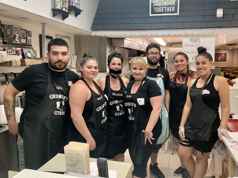 George’s Gyros owner Elaine Sakellariou (with mask) pictured with staff on Friday, the first day of Illinois’ Phase 4 reopening.
