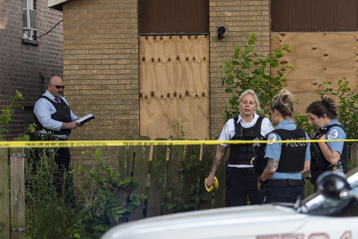 Chicago police investigate the scene where a 5-year-old boy and 19-year-old man were shot June 18, 2020, in Back of the Yards.