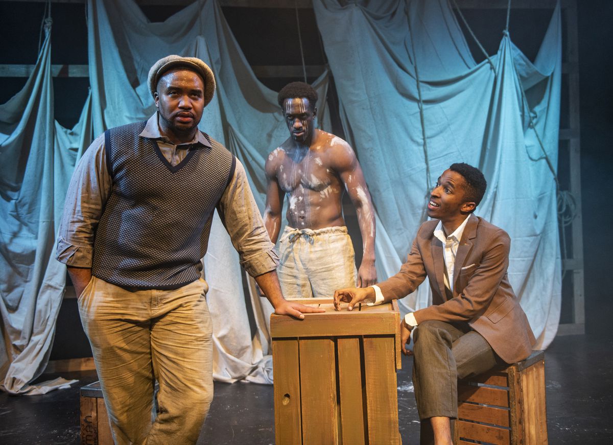 Lewon Johns (from left), David Goodloe and Michael Turrentine star in Griffin Theatre Company’s Midwest premiere of “Mlima’s Tale.”