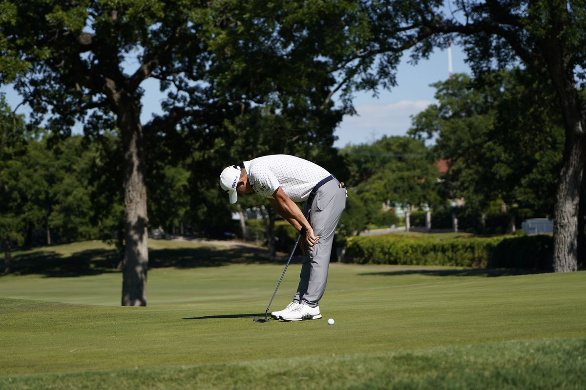 Coilin Morikawa misses a putt on the 17th green during a playoff round Sunday.