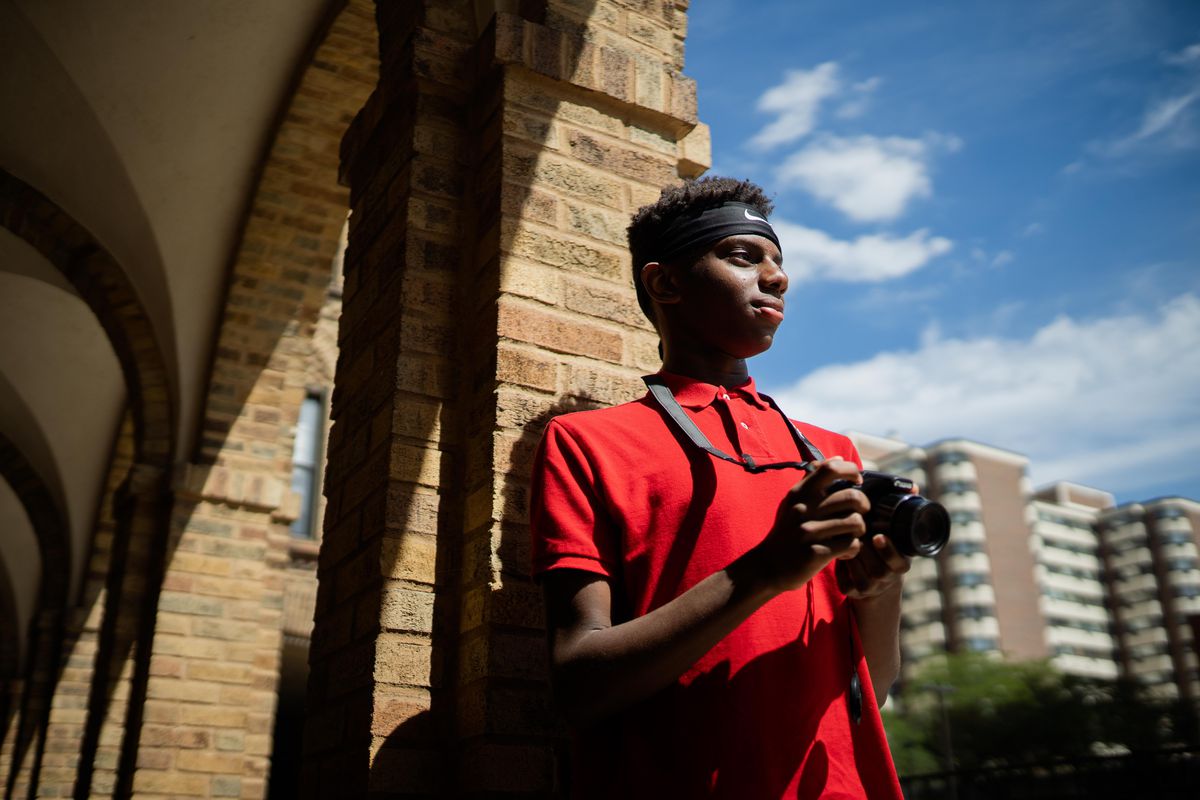 Zachary Slaughter, 14, of Flossmoor, a budding photographer, co-published the book, “Boarded up Chicago: Storefront Images Days After the George Floyd Riots,” with his father, Christopher Slaughter. The two drove the city after the destruction and looting that followed peaceful protests in the wake of the George Floyd police killing, taking photos of the history soon to disappear in the prolific art on plywood. In South Shore on Aug. 29.