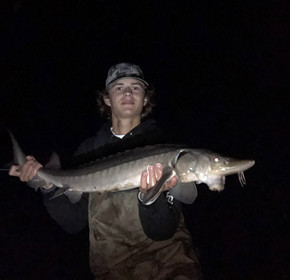 Erik Brztowski with one the sturgeon caught over the weekend around the Wisconsin Dells. Provided photo