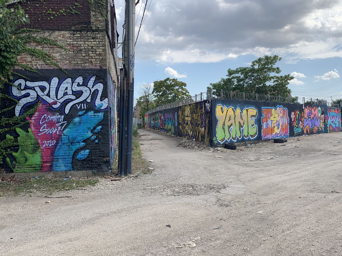 A number of Chicago-area alleys have been transformed into virtual galleries in recent years, like this one in Little Village in the shadow of the Cook County Jail. Dozens of murals were painted there as part of a yearly, all-female graffiti jam called Splash that was started by two women who, for their art, go by the names Bel and Phina.