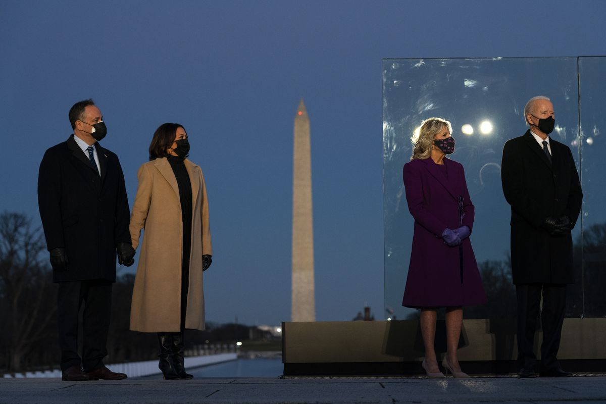 President-elect Joe Biden and his wife Jill Biden are joined by Vice President-elect Kamala Harris and her husband Doug Emhoff during a COVID-19 memorial event at the Lincoln Memorial Reflecting Pool on Jan. 19, the evening before the historic inauguration in Washington, D.C. (AP Photo/Evan Vucci) ORG XMIT: DCEV108